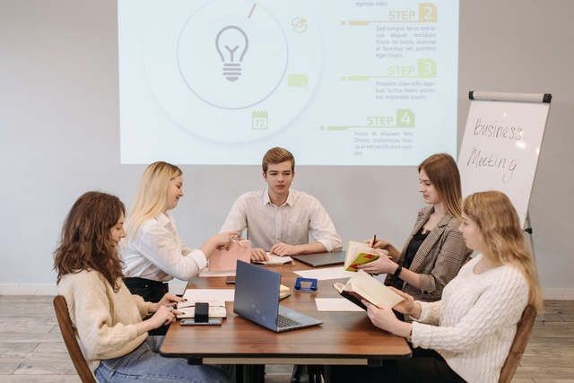 Group of people with PowerPoint presentation